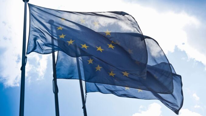 CEO of BitGo Mike Belshe in a chair on-stage at Consensus 2023