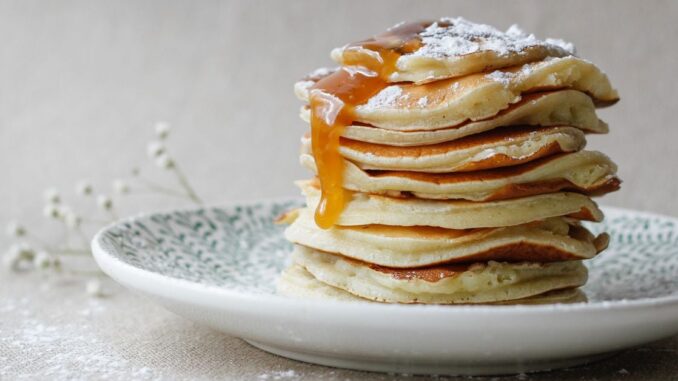 PancakeSwap-Proposes-to-Reduce-CAKE-Token-Supply-by-300-Million.jpg Tyler Spalding, CEO / Co-Founder, Flexa, 2Chainz and Zack Seward, Deputy Editor-in-Chief, CoinDesk