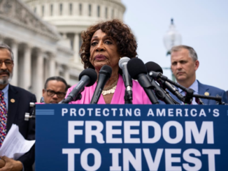 New York Stock Exchange with banner flagging ProShares Bitcoin Strategy ETF on the day it started trading.