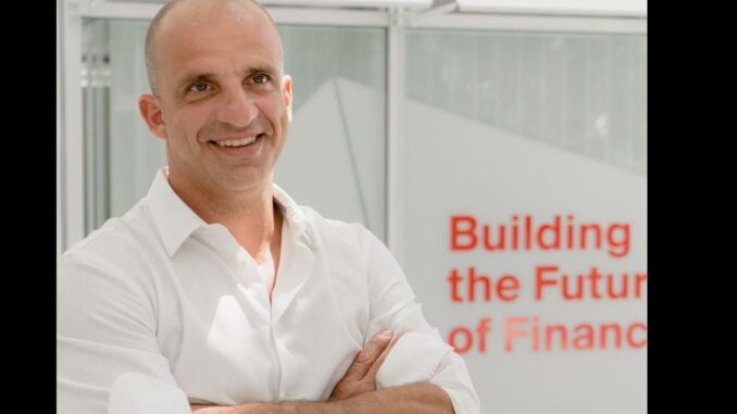 Digital-Asset-Platform-Web3Intelligence-Raises-45M-Ahead-of-New-Token.jpg New York Stock Exchange with banner flagging ProShares Bitcoin Strategy ETF on the day it started trading.