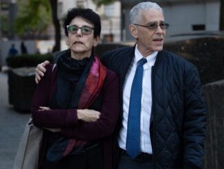 New York Stock Exchange with banner flagging ProShares Bitcoin Strategy ETF on the day it started trading.
