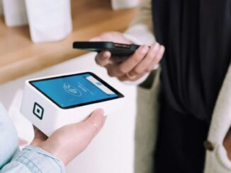 New York Stock Exchange with banner flagging ProShares Bitcoin Strategy ETF on the day it started trading.